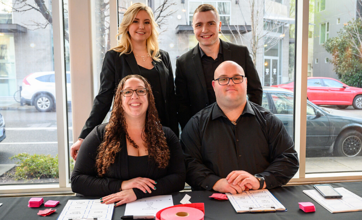 Treadway Events staff posing at welcome table for event