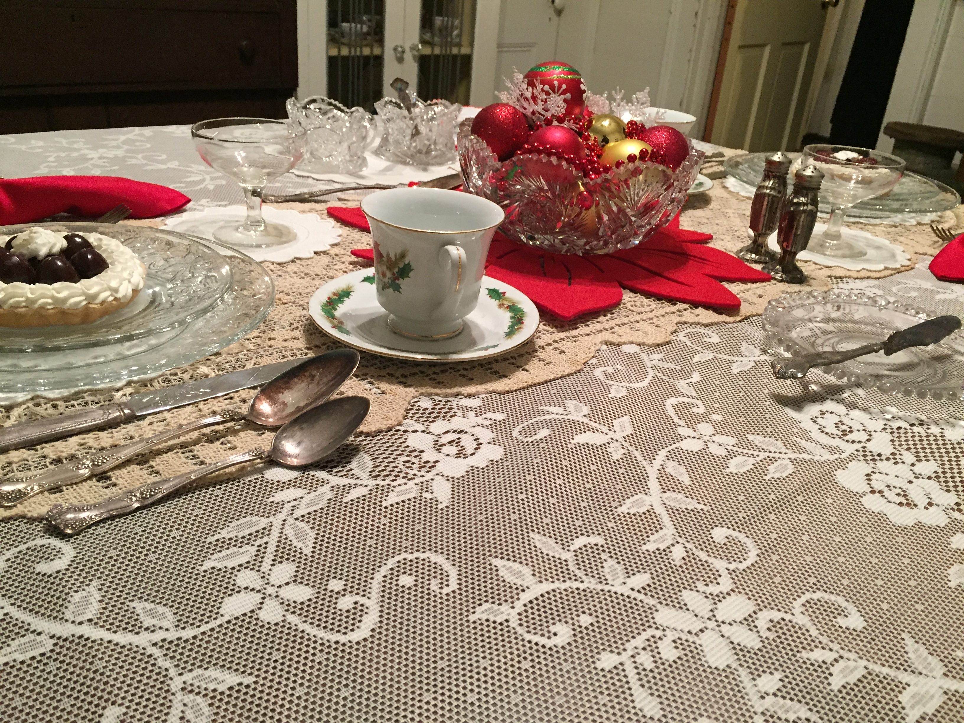 Christmas tablescape with white lace tablecloth at Winterville Christmas Festival
