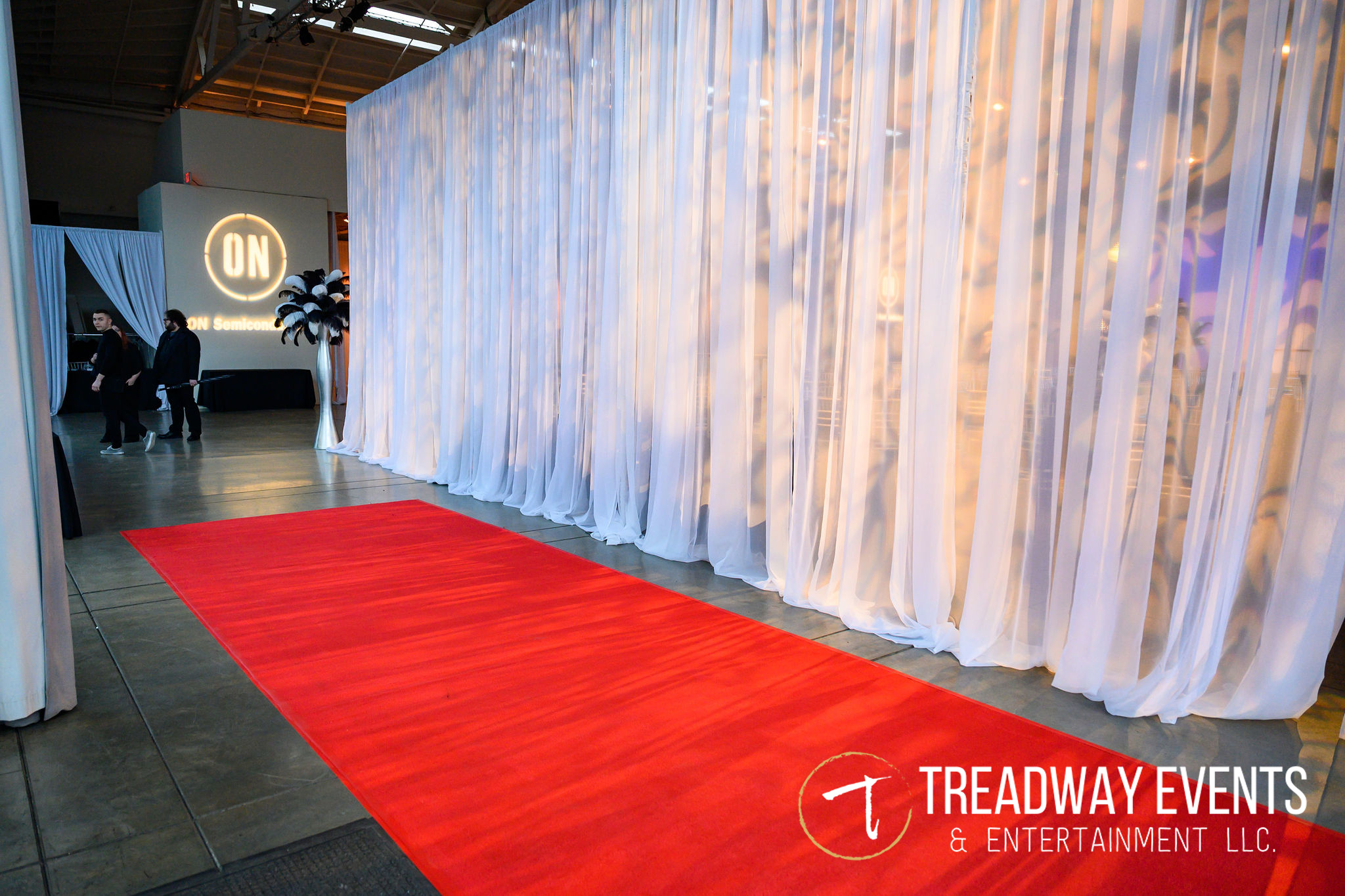 Red carpet with white draped background