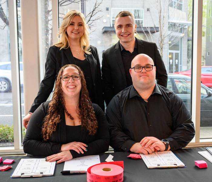 Group of Treadway Events staff at welcome table