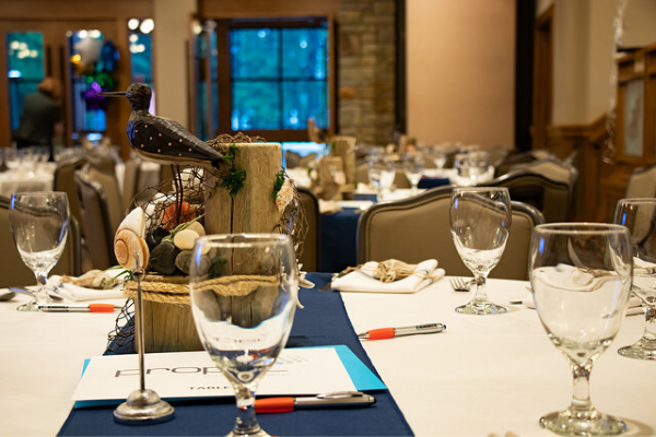 Nautical table setting with a seagull centerpiece