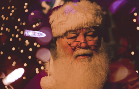 Close up of Santa by Christmas Lights