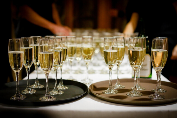 Champagne glasses on serving trays