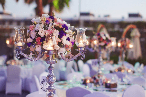 Table centerpiece with candles and flowers