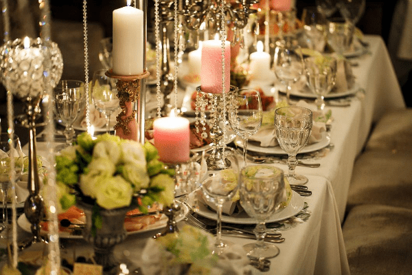Elegant table setting with candles and crystal fixtures