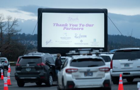 Outdoor movie screen at Love Struck Drive-In event